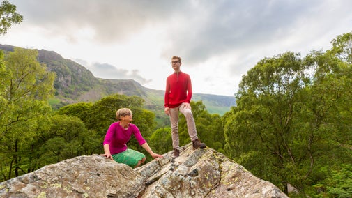 Couple standing on top of the Bowder Stone on a summer's day